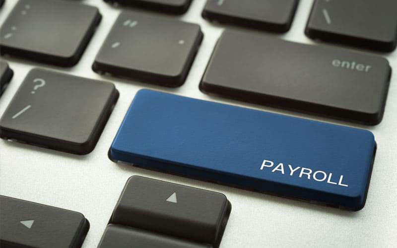 an image of a keyboard showing a button for payroll as this falls under the remit of accounting and taxation