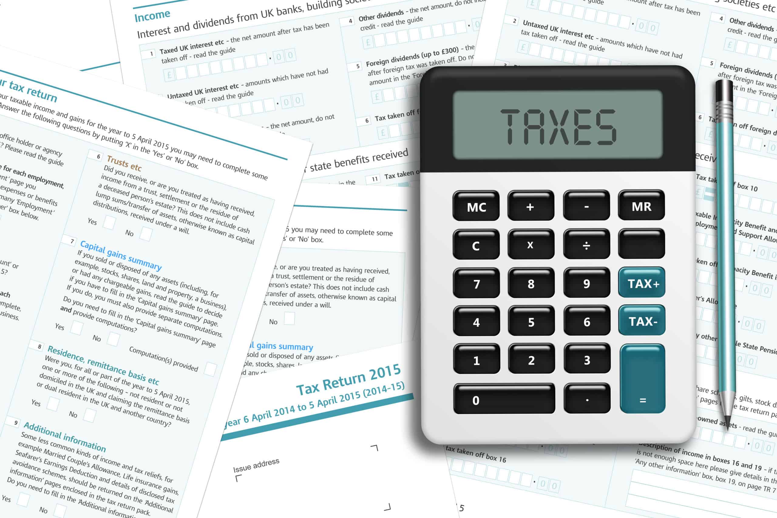 UK tax form with calculator lying on wooden desk which are about to be replaced with MTD software