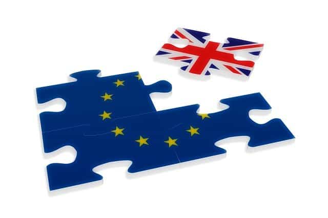A jigsaw of the EU with a piece showing the British flag being removed