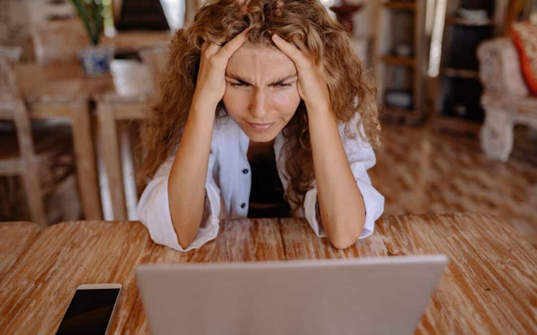 woman-looking-stressed-at-her-laptop-as-ecommerce-growth-begins-to-slow